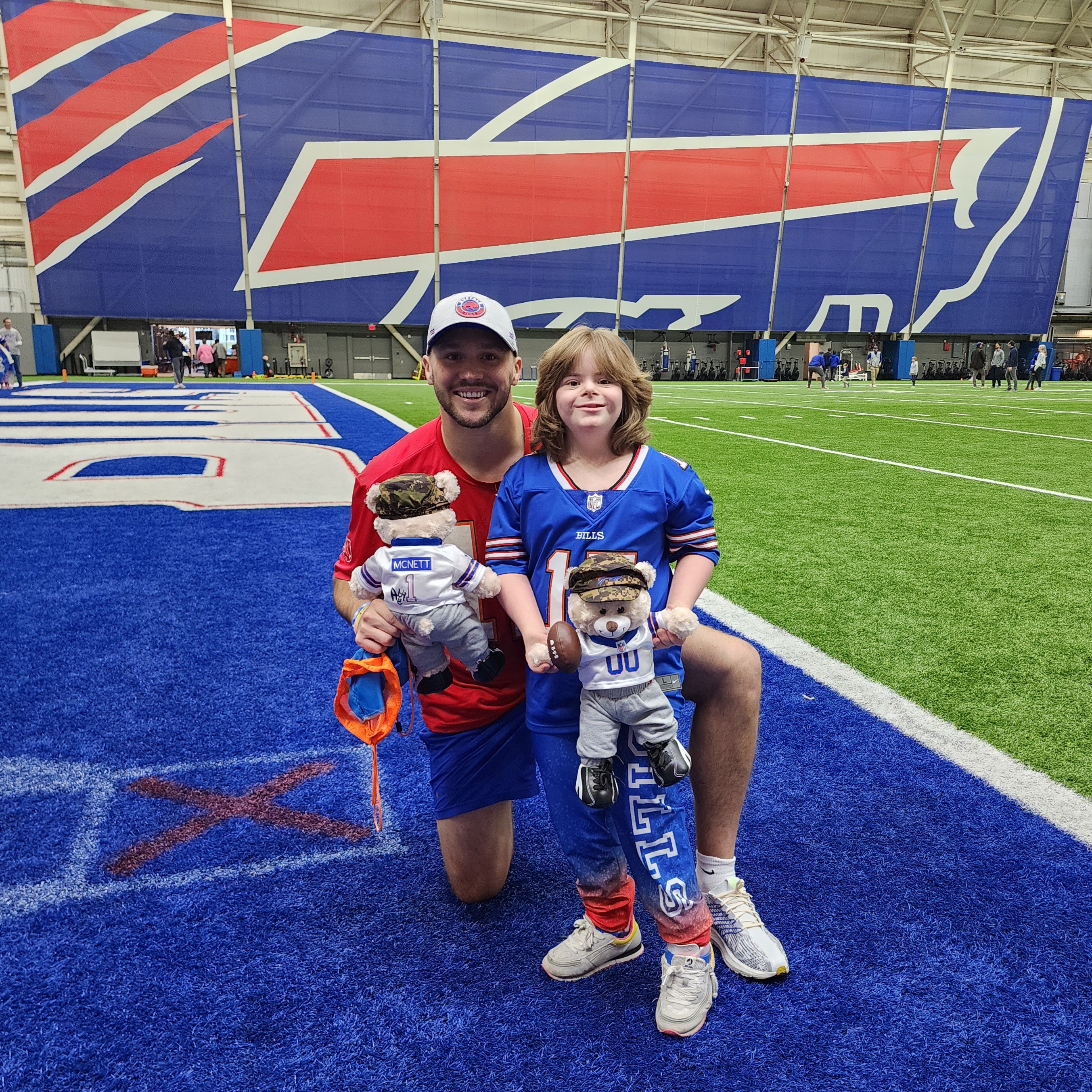 Abbie and Josh on the practice field with new bears